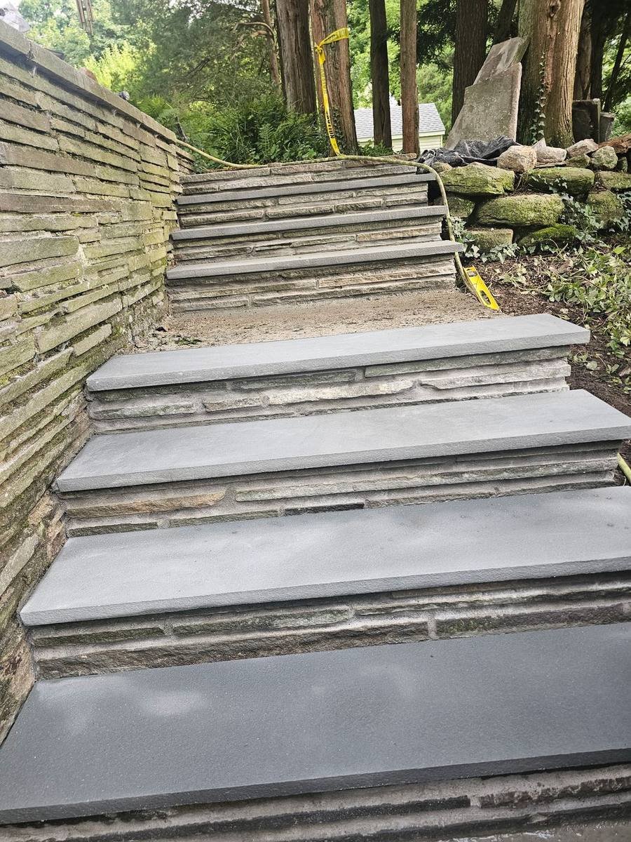 Bluestone steps with natural stone risers built by MS Landscaping & Masonry