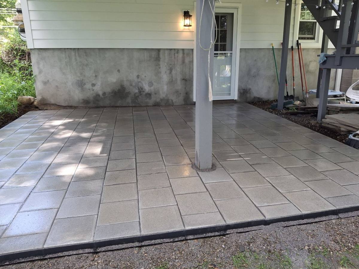 Paver patio installation under deck