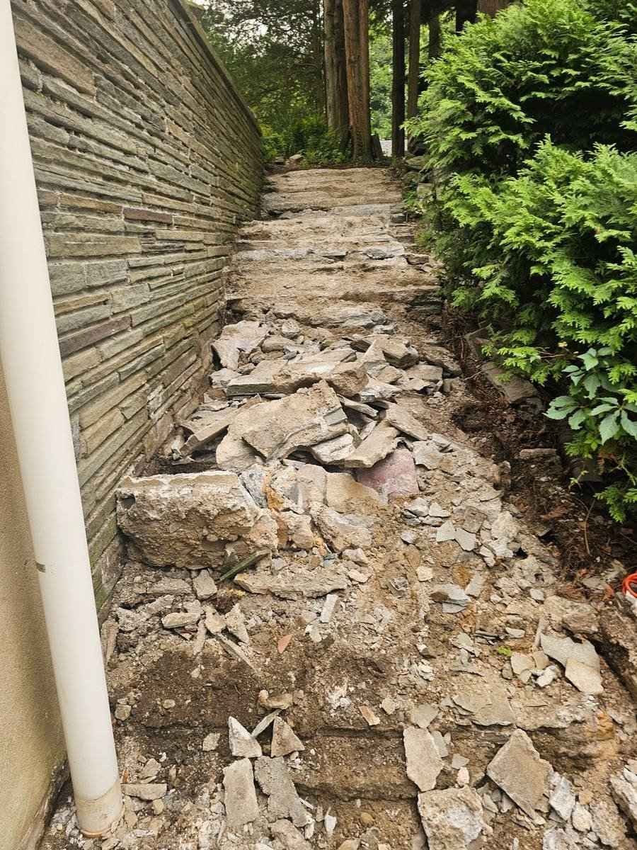 Broken stone stairs before repair